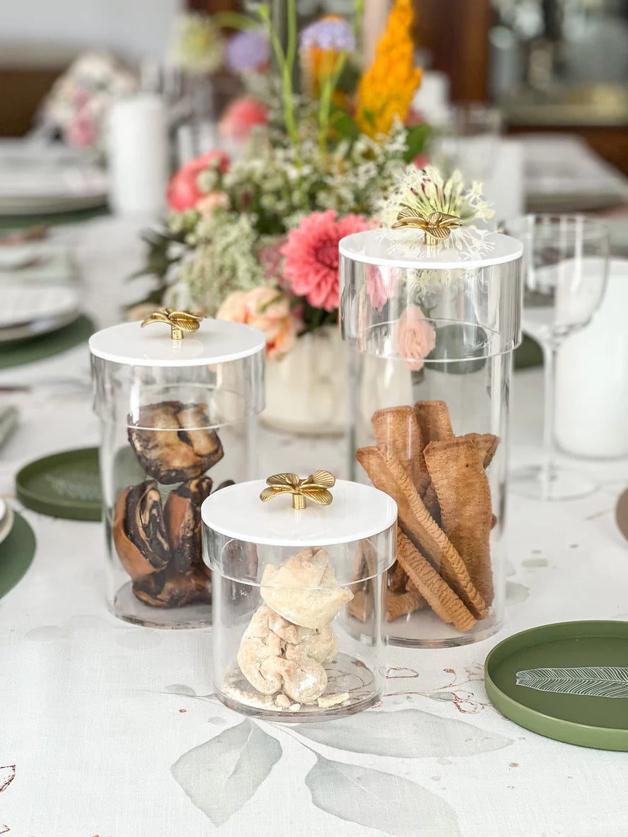 Lucite Cookie jar with gold flower handle top to keep cookies fresh and covered. 