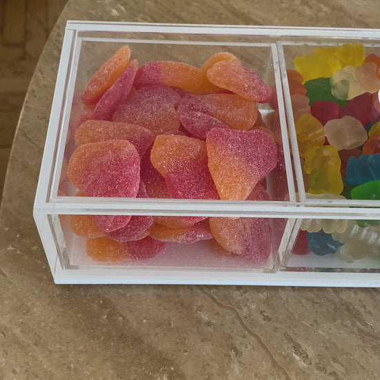 Three sectional lucite serving dish filled with kosher candy